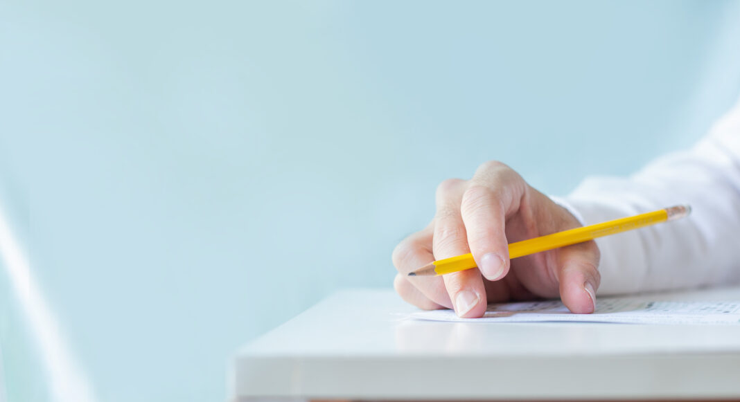 high school,university student study.hands holding pencil writin